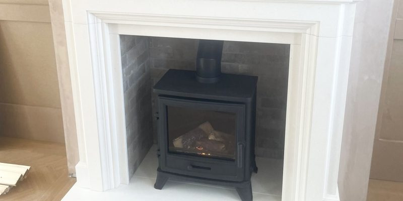 limestone firepalce suite with gas stove